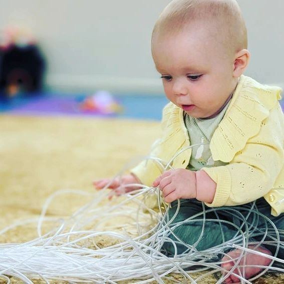 A baby exploring sensory textures