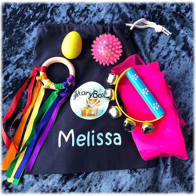 Sensory bag contents: ribbon ring, scarf, shaker, bells and light-up ball